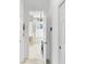 Hallway view into spacious bathroom with tub, shower, vanity, and chandelier at 8116 Collingwood Ct, University Park, FL 34201