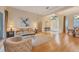 Bright and airy living room with hardwood floors, refined decor, and seamless access to outdoor spaces at 8121 Collingwood Ct, University Park, FL 34201