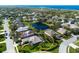 Stunning aerial view of a home near a pond, surrounded by lush greenery and manicured lawns at 8803 18Th Nw Ave, Bradenton, FL 34209