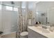 Clean bathroom featuring a shower-tub combo with a floral shower curtain and a large vanity mirror at 8803 18Th Nw Ave, Bradenton, FL 34209