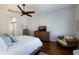 Bedroom featuring a ceiling fan, dark wood floors, and neutral paint at 8803 18Th Nw Ave, Bradenton, FL 34209