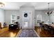 Bright foyer with hardwood floors, transom windows, and an elegant rug offers a warm welcome at 8803 18Th Nw Ave, Bradenton, FL 34209