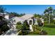 Charming single-story home featuring lush landscaping, a beige exterior, and a welcoming walkway at 8803 18Th Nw Ave, Bradenton, FL 34209