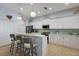 Charming kitchen with white cabinetry, stainless steel appliances, and barstool seating at 8803 18Th Nw Ave, Bradenton, FL 34209