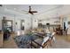 Open-concept living space featuring tile flooring, a ceiling fan, and seamless transition to the kitchen and dining area at 8803 18Th Nw Ave, Bradenton, FL 34209