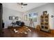 Bright home office with a desk, hardwood floors, and natural light from a large window at 8803 18Th Nw Ave, Bradenton, FL 34209