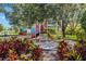 Community playground offers slides and more with shade trees and pretty landscaping at 8803 18Th Nw Ave, Bradenton, FL 34209
