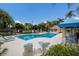 Community pool and jacuzzi with ample lounge seating and poolside cabana at 8803 18Th Nw Ave, Bradenton, FL 34209