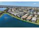 Breathtaking aerial view of a lakeside neighborhood, showcasing beautiful homes at 12326 Blue Hill Trl, Bradenton, FL 34211