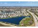 Expansive aerial view of a Primary-planned community near a scenic highway at 12326 Blue Hill Trl, Bradenton, FL 34211
