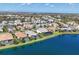Aerial view of lakefront homes with screened in pools and manicured lawns at 12326 Blue Hill Trl, Bradenton, FL 34211