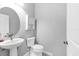 Half-bathroom with pedestal sink and updated fixtures at 12326 Blue Hill Trl, Bradenton, FL 34211