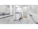 Elegant bathroom with double vanity, granite countertops, and modern fixtures at 12326 Blue Hill Trl, Bradenton, FL 34211