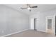 Cozy bedroom with a ceiling fan, closet, and neutral carpet at 12326 Blue Hill Trl, Bradenton, FL 34211
