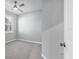 Bedroom with neutral walls and carpet plus a view to the outside through a window at 12326 Blue Hill Trl, Bradenton, FL 34211