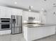 Gourmet kitchen featuring stainless steel appliances, granite countertops, and ample cabinet space at 12326 Blue Hill Trl, Bradenton, FL 34211