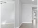 Neutrally painted open living area with view of the home's entry at 12326 Blue Hill Trl, Bradenton, FL 34211