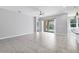 Spacious living area with view of pool and outdoor area at 12326 Blue Hill Trl, Bradenton, FL 34211