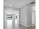 Bright open living space with tile floors, seamlessly connecting living, dining, and kitchen areas at 12326 Blue Hill Trl, Bradenton, FL 34211