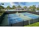Community pickleball courts surrounded by lush landscaping and fencing at 12326 Blue Hill Trl, Bradenton, FL 34211