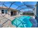 Relaxing screened-in pool area with brick pavers and sunny skies at 12326 Blue Hill Trl, Bradenton, FL 34211
