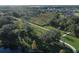 Scenic walking path winding through lush green spaces and mature trees, surrounded by beautiful homes in a desirable community at 12326 Blue Hill Trl, Bradenton, FL 34211