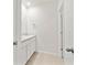 Bathroom with dual sinks and white cabinetry at 12716 Dusty Trail Dr, Sarasota, FL 34238