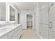 Elegant bathroom with double vanity, glass shower, and modern fixtures at 12716 Dusty Trail Dr, Sarasota, FL 34238