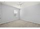 Neutral bedroom with carpeted floor, ceiling fan, and window at 12716 Dusty Trail Dr, Sarasota, FL 34238
