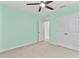 This bedroom has carpet, a ceiling fan, and a closet at 12716 Dusty Trail Dr, Sarasota, FL 34238