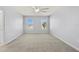 Bright bedroom with a ceiling fan and a large window at 12716 Dusty Trail Dr, Sarasota, FL 34238