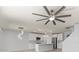 Modern kitchen open to living area with stainless steel appliances and island seating at 12716 Dusty Trail Dr, Sarasota, FL 34238