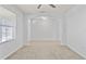 Spacious room with a decorative archway and a large window at 12716 Dusty Trail Dr, Sarasota, FL 34238
