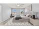 Serene bedroom with ample light, neutral decor, and stylish furnishings at 12716 Dusty Trail Dr, Sarasota, FL 34238