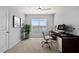 Functional home office with desk space, natural light, and modern decor at 12716 Dusty Trail Dr, Sarasota, FL 34238