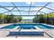 Beautiful pool with water features and a view of the adjacent pond at 12716 Dusty Trail Dr, Sarasota, FL 34238