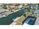 Waterfront property featuring a screened-in pool, boat dock, and canal access in a serene community at 1541 Shelburne Ln, Sarasota, FL 34231