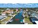 Scenic aerial view of waterfront homes along a canal, showcasing boat docks and lush landscaping at 1541 Shelburne Ln, Sarasota, FL 34231