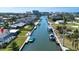 Breathtaking aerial view of a waterfront community with canals, boat docks, and beautiful residential homes at 1541 Shelburne Ln, Sarasota, FL 34231