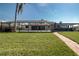 Spacious backyard with screened pool area, perfect for outdoor living and entertaining at 1541 Shelburne Ln, Sarasota, FL 34231