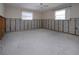 Bedroom renovation showing cinder block wall framing, natural light from two windows at 1541 Shelburne Ln, Sarasota, FL 34231