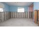 Light blue bedroom with walls partially exposed, awaiting finishing touches at 1541 Shelburne Ln, Sarasota, FL 34231
