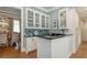 Bar area with white cabinetry, a mosaic tile backsplash, and black countertops at 1543 Eastbrook Dr, Sarasota, FL 34231
