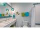 Bright white bathroom with modern fixtures and a coordinated color scheme at 1543 Eastbrook Dr, Sarasota, FL 34231