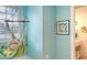 View of hammock and bright blue wall detail in bedroom, adjacent to the en-suite at 1543 Eastbrook Dr, Sarasota, FL 34231