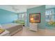 bedroom with a large picture window with window seat, hammock, and white furnishings at 1543 Eastbrook Dr, Sarasota, FL 34231