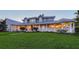 An attractive home boasts a generous front lawn, graceful columns, and a welcoming facade at 1543 Eastbrook Dr, Sarasota, FL 34231