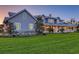 A picturesque home exhibits a sprawling lawn, inviting front porch, and timeless architectural design at 1543 Eastbrook Dr, Sarasota, FL 34231