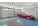 Spacious three-car garage with painted floor and plenty of room for parking and storage at 1543 Eastbrook Dr, Sarasota, FL 34231