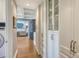 Hallway lined with custom built-in cabinets and drawers, leading into a spacious living area at 1543 Eastbrook Dr, Sarasota, FL 34231